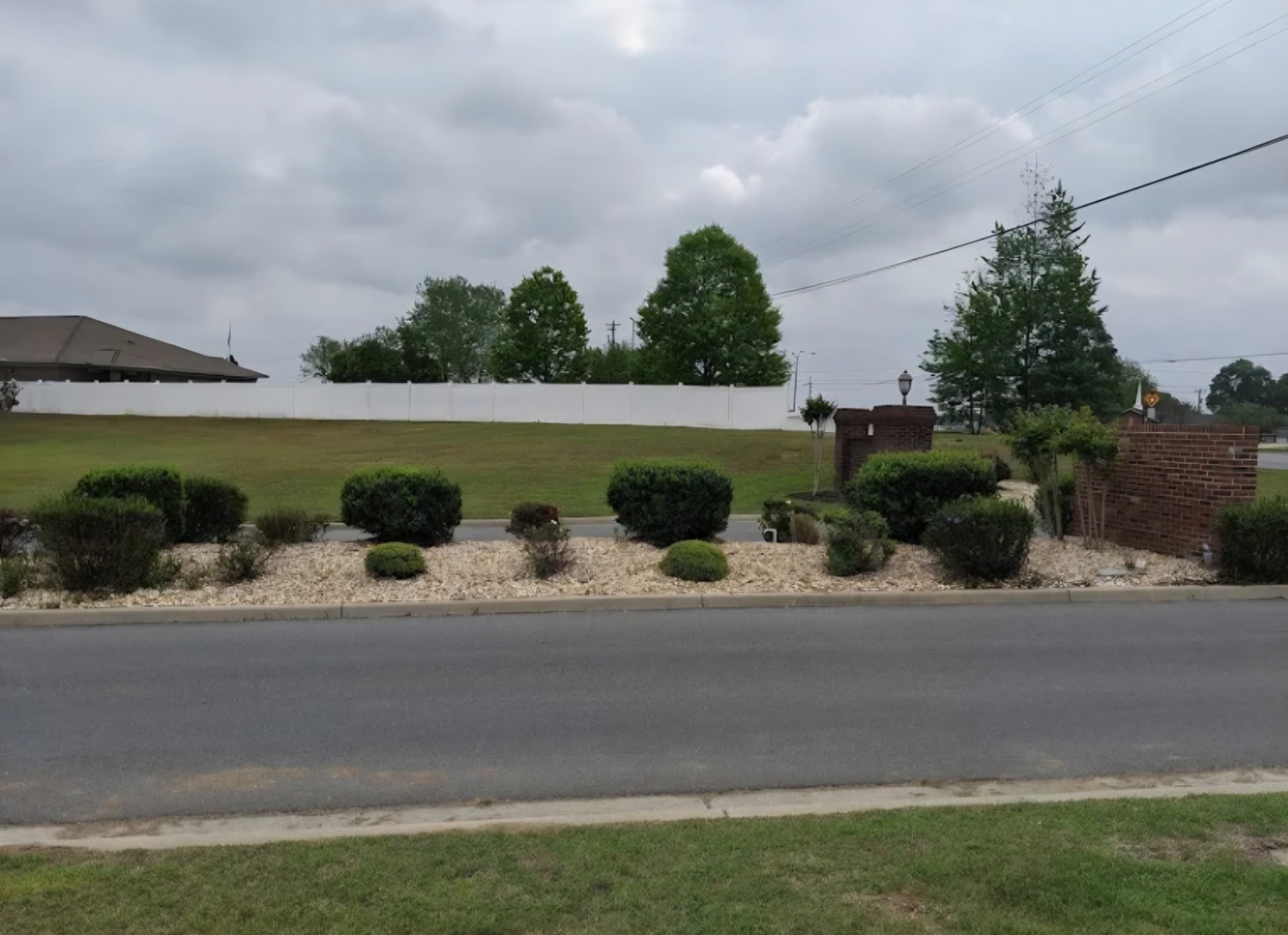 Commercial roadside hedge trimming and fresh mulch beds
